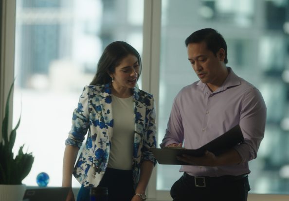man and woman employee reviewing documents together